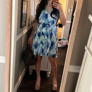 Blue dress with flowers and pleats